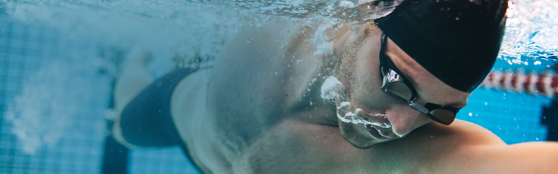 Swimmer wearing prescription swim goggles